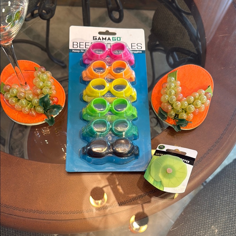 Gama Go Beer Goggles Set with wine glass footwear and lily pad wine stopper.